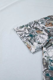 Earthy camouflage print henley t-shirt with short sleeves and button detail.