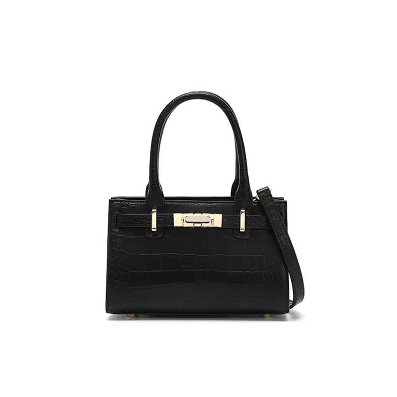 Black crocodile-embossed mini tote handbag with gold hardware and top handles.