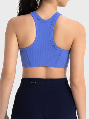 Ribbed racerback crop top in blue with contour stitching and a racerback design.