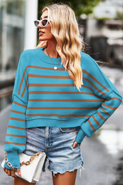 Sky blue and tan striped knit crewneck sweater with a boxy fit and dropped shoulders.
