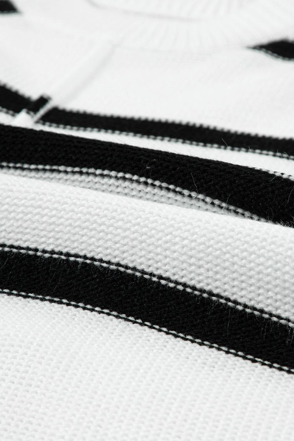 Horizontal stripe knit shell top in white with black stripes, acrylic knit fabric.