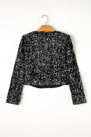 Black sequin embellished cropped open jacket with long sleeves.