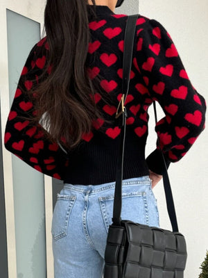Black acrylic knit cardigan with red hearts and puff sleeves