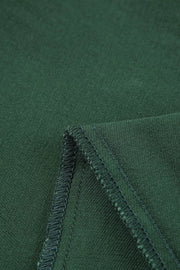 Green cotton jeans with crossed v-waist detail and visible stitching.