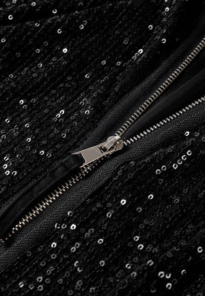 Black sequin bomber jacket with silver zipper detail and ribbed trim.