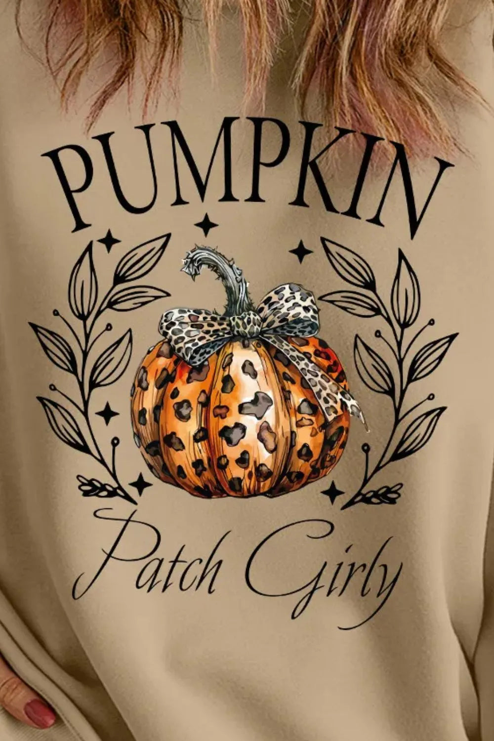 Khaki crewneck sweatshirt with a leopard print pumpkin graphic and "Pumpkin Patch Girly" text.