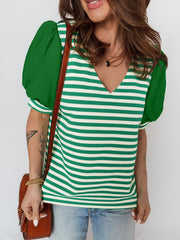 Striped v-neck sweater with green puff sleeves and a textured knit.