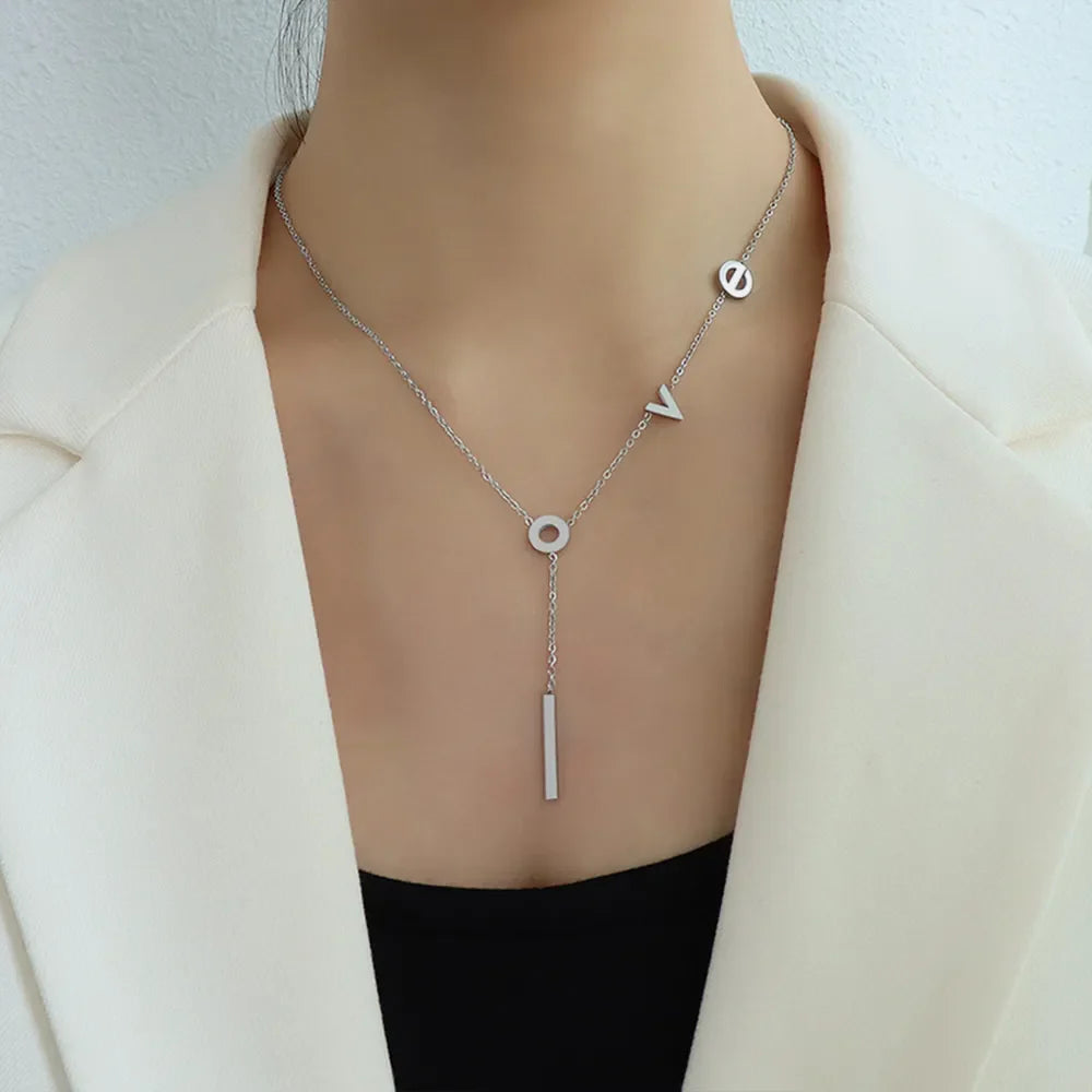 Silver Love Letter Pendant Necklace with bar drop detail.