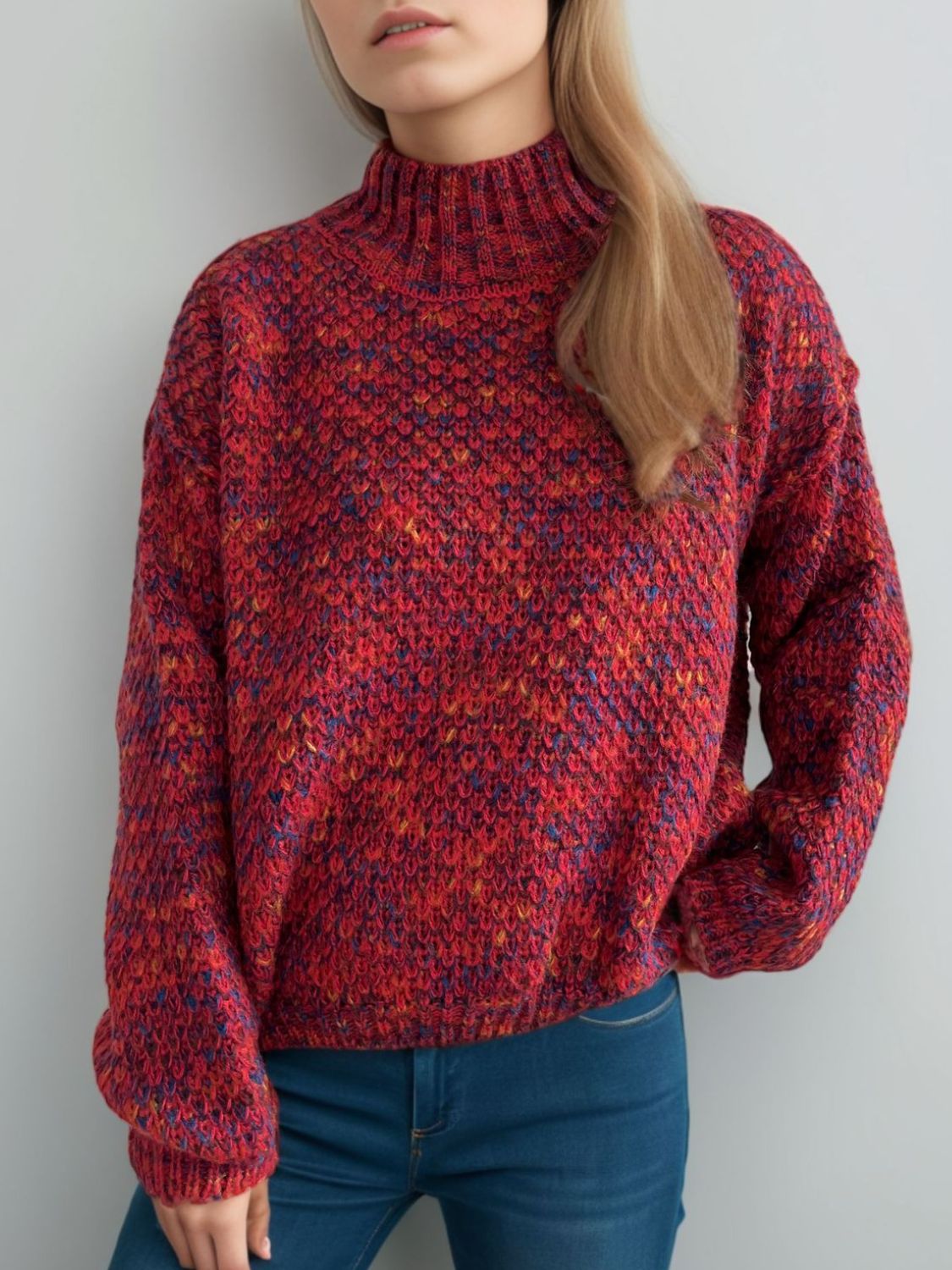 Textured mélange mock neck pullover sweater in deep red with multicolor flecks, acrylic knit.