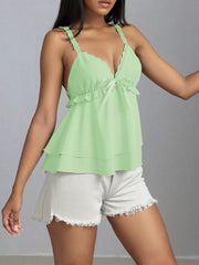 Light green layered cami with lace trim, V-neck, bow detail, and ruffle straps.
