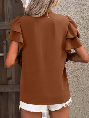 Brown ruffled sleeve blouse with a plunge neckline.