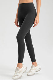 Dark Gray high-waist performance leggings with sculpting seams.