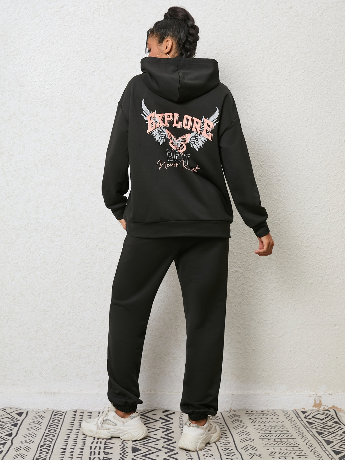 Black graphic hoodie and jogger set with butterfly and text print.