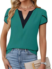 Peacock green blouse with black trim V-neck and petal sleeves.