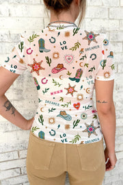 Women's white mesh tunic with colorful western print, short sleeves, and crew neck.