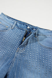 Embellished denim shorts in medium wash with allover rhinestone detail.