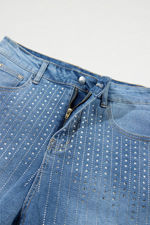 Embellished denim shorts in medium wash with allover rhinestone detail.