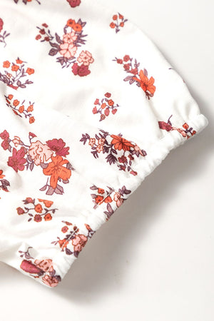 Gathered bust floral puff sleeve blouse with elastic cuffs and hem.