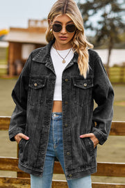 Black oversized denim trucker jacket with classic buttoned front and chest pockets.