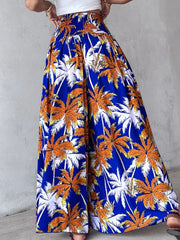 Bohemian print wide-leg pants in Royal Blue with smocked waist and palm tree pattern.