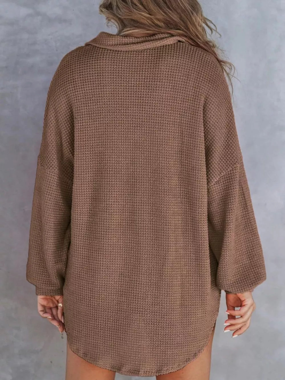 Brown waffle-knit henley tee with a collar and long sleeves.