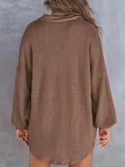 Brown waffle-knit henley tee with a collar and long sleeves.