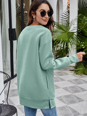 Sage extended hemline sweatshirt with side pockets and crew neck.