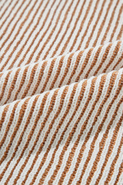 Camel and white striped knit sweater with a textured stitch detail