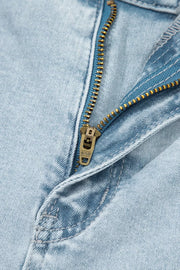 Light wash denim jeans with a brass zipper detail