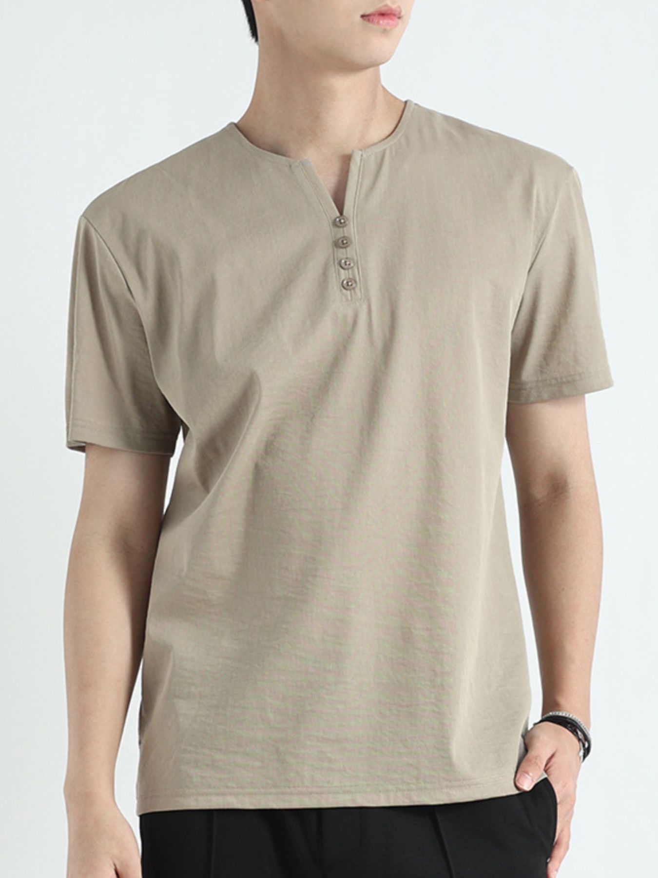 Men's sage short sleeve cotton henley t-shirt with button placket.