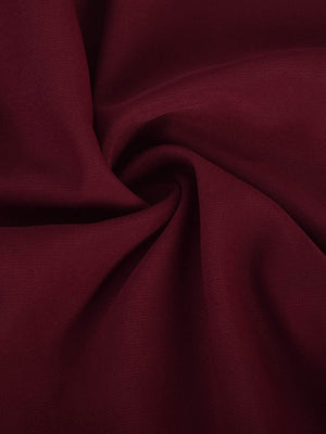 Burgundy asymmetric drape playsuit with elastic waist detail