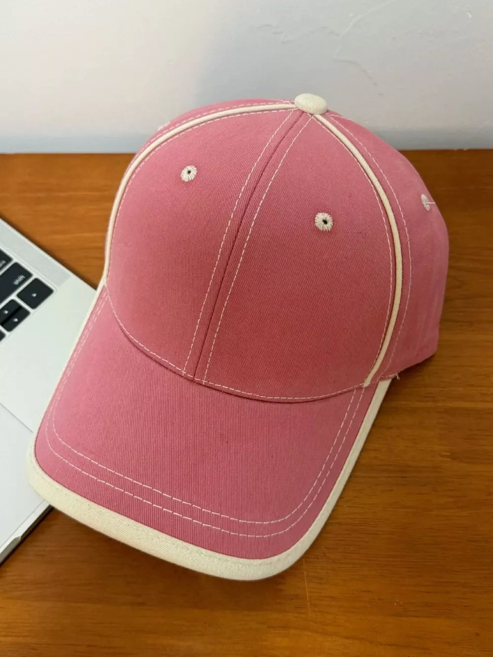 Dusty Rose cotton baseball cap with contrast stitching and cream trim