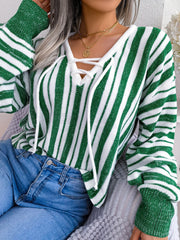 Green and white striped knit cropped pullover sweater with lace-up neckline detail.