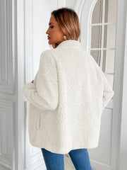 White teddy fleece jacket with patch pockets, a mock neck, and long sleeves.