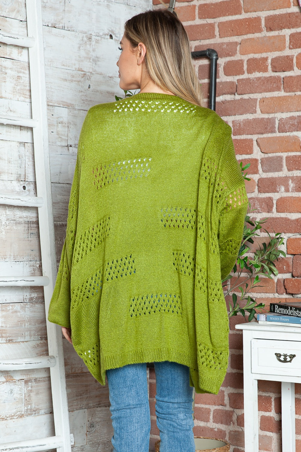 Open-knit slouchy cardigan in matcha green with a relaxed fit and open weave details.