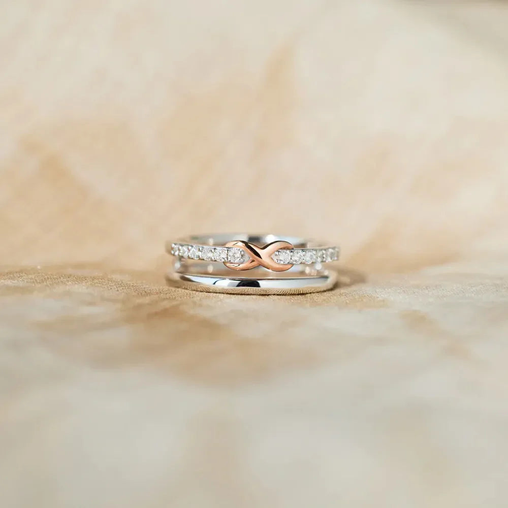 Infinity knot trio ring set in silver with rose gold accent and clear stones