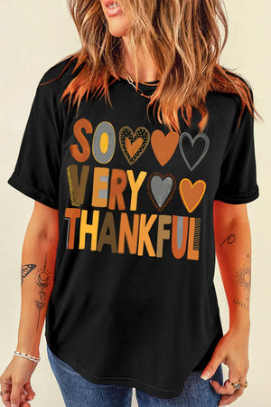 Black graphic tee with "So Very Thankful" text and heart details
