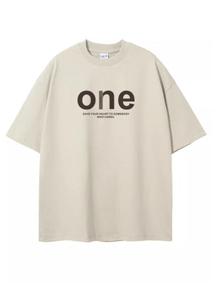 Beige cotton crew neck t-shirt with oversized fit and "one" graphic print.