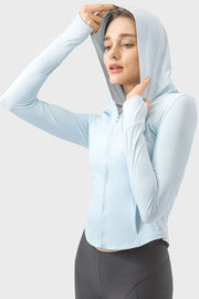 Light blue active hoodie with thumbholes and zipper closure, worn by a model.