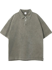 Oversized washed sage polo shirt with short sleeves and a two-button placket.