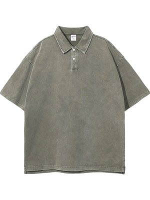 Oversized washed sage polo shirt with short sleeves and a two-button placket.