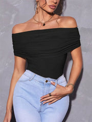 Black off-shoulder ruched t-shirt with short sleeves, styled with light wash jeans.