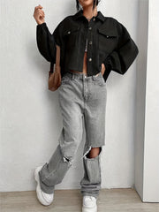 Black corduroy blouson jacket with balloon sleeves and cropped length.