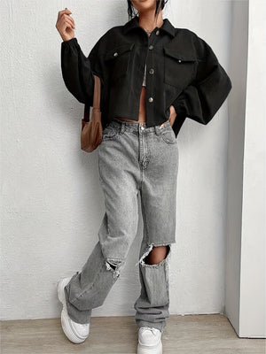 Black corduroy blouson jacket with balloon sleeves and cropped length.