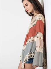 Crochet-trimmed long sleeve cardigan in colorblock with fringe detail.