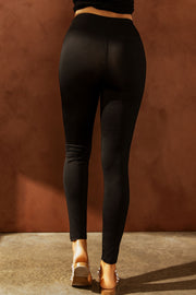 Black performance leggings with knee slits and a distressed detail.