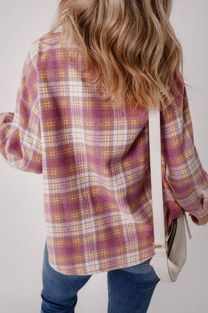 Oversized pink plaid flannel button-down shirt with white and yellow accents.