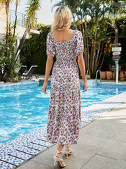 Shirred bodice paisley midi dress in red-violet with short sleeves and square neckline.