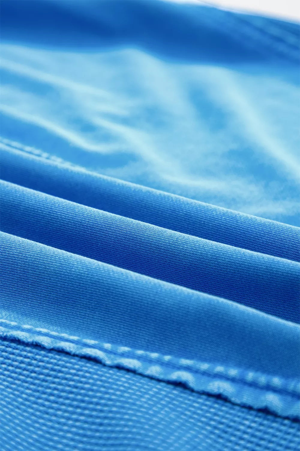 Blue mineral wash cotton tee with visible stitching detail