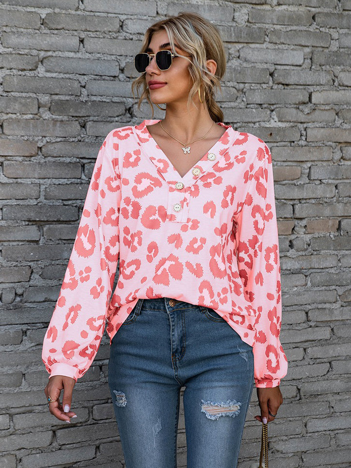 Pink leopard print blouse with blouson sleeves and button detail
